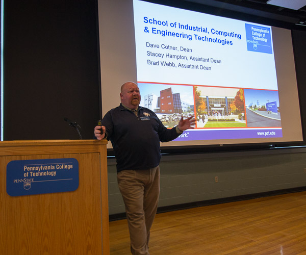 David R. Cotner, dean of industrial, computing and engineering technologies, delivers one of the six academic-school overviews taking place across campus.