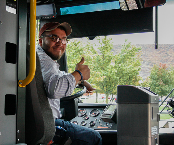 Nathan Michaels, a bus driver with River Valley Transit, signals his approval as the day “rolls” on. Visitors availed themselves of free rides on shuttles around main campus and to the Lumley Aviation Center and Schneebeli Earth Science Center.