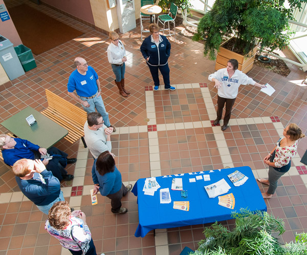 In the Breuder Advanced Technology & Health Sciences Center lobby, alumni relations director Tammy M. Rich welcomes Williamsport Area Community College alumni and their guests to the second annual WACC Reunion.