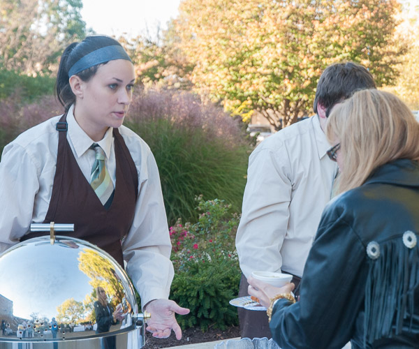 Jaclyn C. Gregg, a culinary arts and systems student from Warriors Mark, and Ethan B. HInkel, of Muncy, culinary arts technology (partially obscured), serve fritters and potato-and-beer soup.
