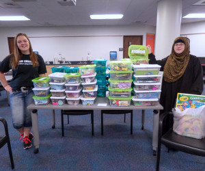 Early childhood students Khloe L. Musser (left), of Lemont, and Megan E. McCaslin, of Williamsport, display 72 boxes of children’s items collected by the Early Educators club as part of the Jared Box Project, which aims to uplift the spirits of children in hospitals.