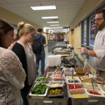 Christopher R. Grove, dining services manager, tempts patrons with a colorful palette of samples.
