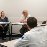 Michelle A. Walczak, associate professor of nursing, asks students to consider the patient’s emotions as first responders arrive.