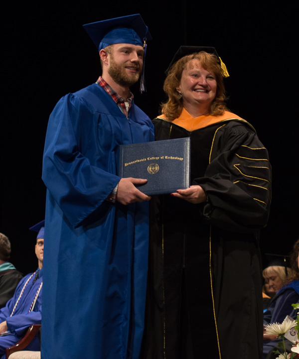 Dulcey J. Messersmith, instructor of nursing, poses for a special moment with her son, Justin G. Smith, a graduate in welding technology.