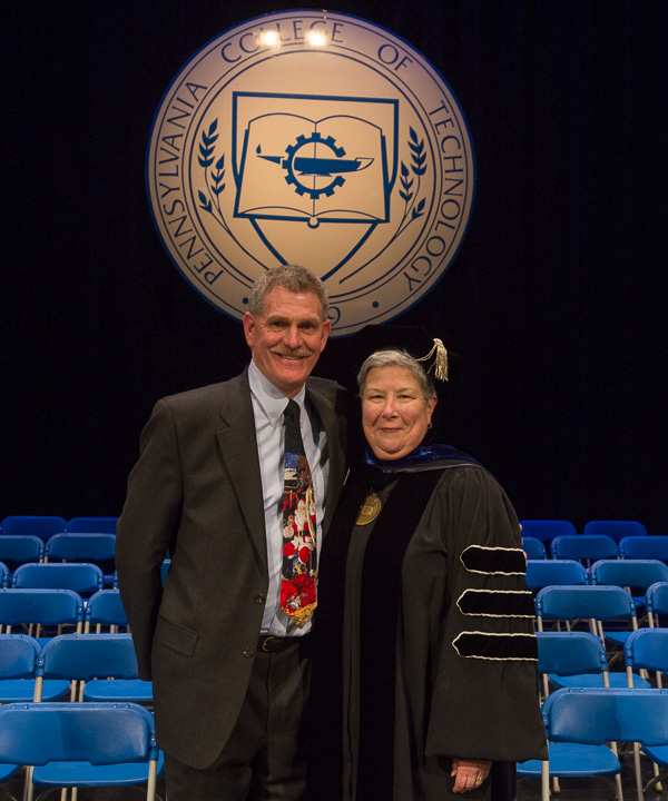 As the curtain closes on another commencement and Registrar Denny L. Dunkleberger’s college career, he and President Gilmour (who publicly noted his 35 years of service from the podium) pose for a keepsake. 