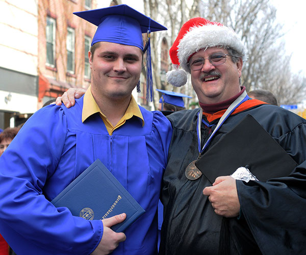 Pride and elation are on the menu as Chef Paul E. Mach and his son, Jeffrey P., delight in an associate degree in forest technology. (It was a big weekend for the Machs. Older son Vincent earned his master's degree from Carlow University the night before.)