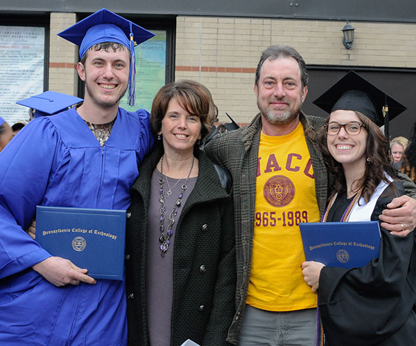 The Wiegand family from Trout Run forms a portrait of Penn College Pride. From left are Benjamin J., who graduated with an associate degree in heavy construction equipment technology: technician emphasis; parents Brenda A., the college's internal facilities coordinator and a business management student, and Joseph A., who graduated from Williamsport Area Community College in machinist general and toolmaking technology; and Jessica R., who plans to earn a bachelor's in business administration: marketing concentration in May.