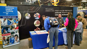 Majors within the college’s School of Health Sciences are explained at the 2015 Pennsylvania Farm Show by Edward A. Henninger (left), dean, and Scott A. Geist, director of surgical technology.