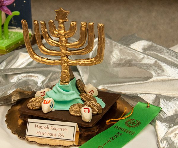 A Hanukkah-inspired chocolate sculpture by Hannah Kegerreis, of Presto, receives honorable mention in Principles of Chocolate Works.