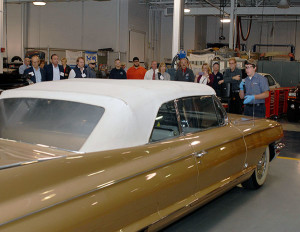 Ryan J. Haslett, an automotive restoration technology major from Warren, tells the tour group about a 1961 Cadillac Eldorado on loan to Penn Collegefrom the William E. Swigart Jr. Automobile Museum in Huntingdon.