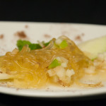 Noodles made from apple cider that is gelled with agar agar, a vegetarian gelatin, and piped through tubes, are the centerpiece of a dish that is dressed with apple pieces and cinnamon.
