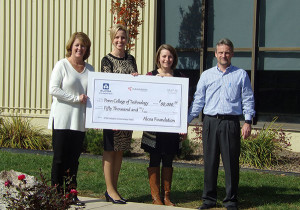 Executives from Kawneer Company Inc. in Bloomsburg, part of Alcoa’s Building and Construction Systems business, present an Alcoa Foundation grant to Penn College. From left: Natalie McIntyre, human resources manager; Elizabeth A. Biddle, director of corporate relations at Penn College; Sarah Moscatello, human resources generalist and grant coordinator; and Axel Heinrich, plant manager.