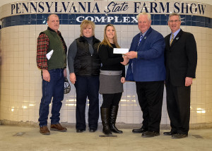Pennsylvania College of Technology student Paige E. Pearson, of Williamsburg, was among recipients of the 2016 Pennsylvania Farm Show Scholarship. From left are her parents, Lyle and Trisha Pearson; Paige Pearson; Scott Sechler, owner of Bell and Evans; and Pennsylvania Agriculture Secretary Russell Redding.
