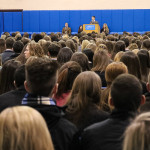 Joseph J. Balduino, director of admissions, greets the throng of high schoolers in the college’s Field House.
