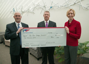 First National Bank’s Peter Bower (left), senior vice president and commercial banking team leader, and Chris Sullivan, vice president and market manager, deliver a $10,000 donation to Penn College’s Elizabeth A. Biddle, director of corporate relations. The contribution will support the college’s SMART Girls and Penn College NOW programs for high school students.