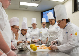 Pennsylvania College of Technology’s Chef Mary G. Trometter, assistant professor of hospitality management/culinary arts, leads first-year students culinary and baking and pastry arts majors in one of the college’s well-equipped labs.