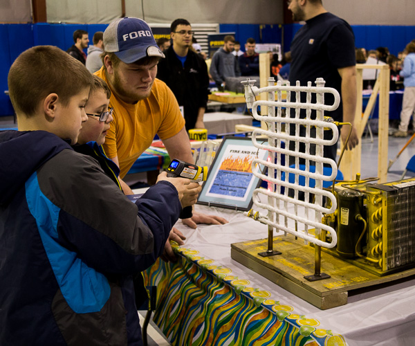 The Penn College student chapter of the American Society of Heating, Refrigerating and Air Conditioning Engineers displays condensor coils in the Field House.