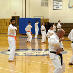 Penn College martial arts coach George T. Vance Jr. (right foreground) demonstrates during a November belt promotion ...
