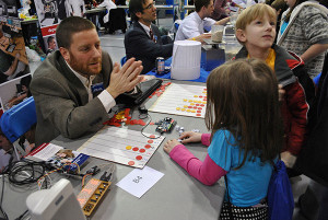 Edward J. Almasy, assistant professor of electronics, explores statistical principles with visitors to a previous Science Festival at Penn College. The community is invited to the fifth annual event – geared for elementary and middle school students and their families – on Feb. 18 in the college’s Field House.