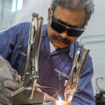 Automotive restoration technology student Krishna Yadav practices gas welding on steel in College Avenue Labs.