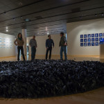 The artist, second from right, discusses “The Clearing” with engaged educators and artists. The 18’ x 12’ work of stoneware and cast crystal arrived for installation in 120 wooden boxes. 