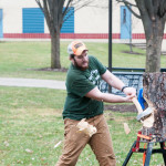 James C. Synol, a building automation technology major from Bloomingdale, N.J., sends wood chips flying.