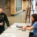 The faculty member talks one-on-one with Sarah E. Ruhlman, a Web and interactive media major from New Oxford.