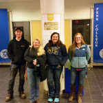 Four members of Residence Life's Automotive LLC, still smiling on their 1 a.m. return from a Harrisburg adventure.