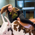 Shaye A. Vilkas, a pre-dental hygiene student from York, holds on for a wild ride.