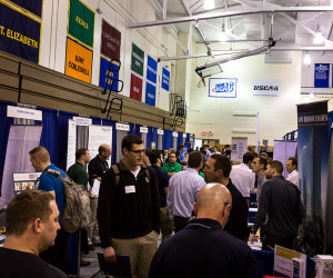 Students, alumni and employers mingle on the Bardo Gym floor during the Spring Career Fair.