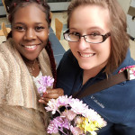 Kyeesha C. Howard (left), a legal assistant/paralegal student from Philadelphia, receives flowers from College Women of Williamsport, represented by April M. Tucker, of Muncy, majoring in applied human services.