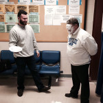 A good-natured Marc E. Bridgens takes a pie from Ian E. Gardepe, an engineering CAD technology student from Hawley ...