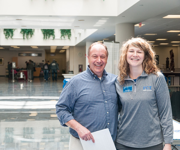 Steven J. Moff, a Penn College business professor and owner of off-site student housing, joins Katie L. Mackey, coordinator of off-campus living and commuter services, in Madigan Library, where local landlords could meet with prospective tenants. 