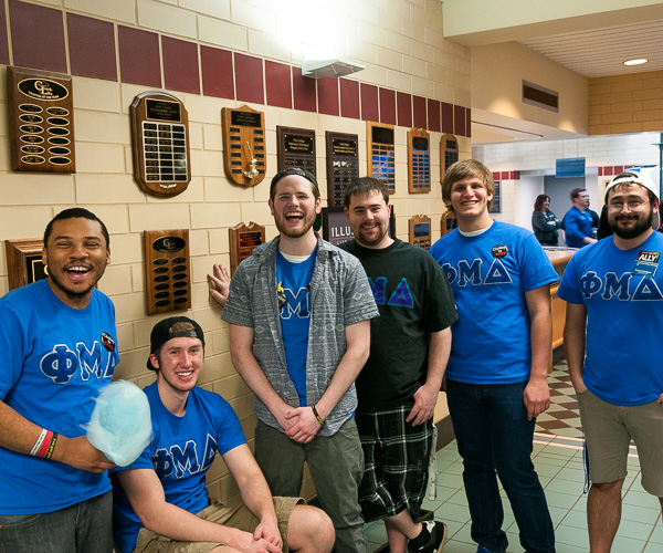The brothers of Phi Mu Delta, one of the college's three fraternities, happily represent Greek Life at a Campus Life Involvement Fair.
