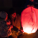 Web developer Michael Richards and daughter Amelia prepare to launch their lantern.