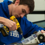 Attending to details are William C. Hayden, of Greensburg, an engineering design technology major ...