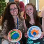 Alexandra D. Petrizzi (left), a dental hygiene: health policy and administration concentration major from Langhorne, and Amanda N. Suda, of Harrisburg, enrolled in landscape/horticulture technology: plant production emphasis, display their colorful take-home novelties.