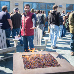 Warding off the morning chill by the Bush Campus Center fire pit is Hamad H. Almarri, a student from Saudi Arabia anticipating his degree in heating, ventilation and air conditioning design technology.