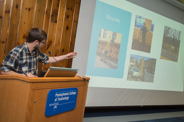 Erik G. Knecht, manufacturing engineering technology, engages the audience with tales of 3-D printing, Baja racing and homemade bicycles he’s been crafting – including one that measures 12 feet tall.