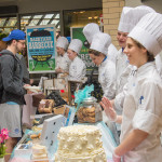Students describe their products and serve up samples in the Hager Lifelong Education Center lobby.