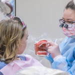 Crystal C. Harrison, of Dallastown, shares with Madison Stout tips on thorough toothbrushing ...