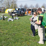 As role-playing humans and dummy patients cover the ground after a simulated drone attack, students Brittany L. Neupauer and Christopher H. Warney, both of Williamsport, assess the response.