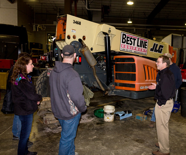 Bill J. Bashista Jr., diesel equipment technology instructor, leads a laboratory tour.