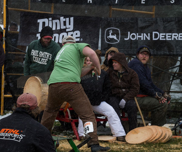 Synol competes in the Single Buck event at the Stihl qualifier. Members of the Penn College Woodsmen’s Team – MaeKayla L. Brown; Kristin E. Cavanaugh, of Bellefonte; and Paul M. George – sit on the stanchion in the background.
