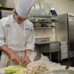 R. Colby Janowitz, of Westminster, Md., chops vegetables for his group’s macrobiotic dish.