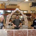 The stuff of selfies: After scouring the lab for a serviceable keystone to top their Gothic arch, Penn State students celebrate the stability of their handiwork.