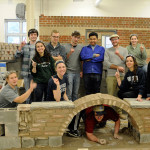 Scurrying into position and flashing a "No. 1" for their winning amalgamation, the day's winners savor their success.