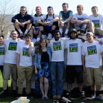 With its brothers appropriately clad and joined by student Brittany R. Terpstra, a friend of the fraternity, Sigma Pi prepares for a brush-and-roller campaign ...