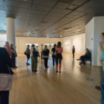 Gallery visitors listen to the artist’s talk.