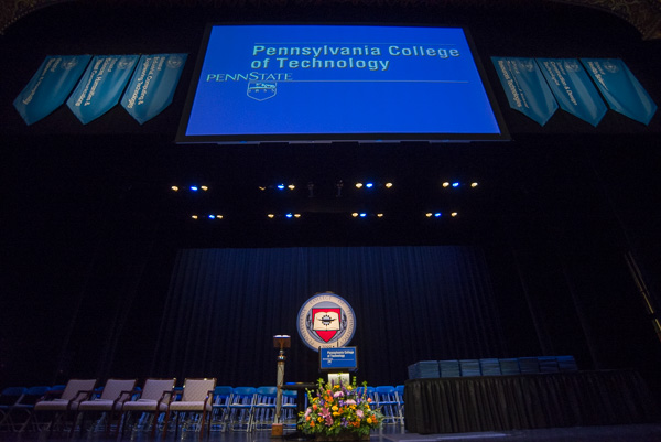 The stage is set! … and includes a new college seal in the background. 